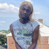 a young man wearing a t - shirt with a basketball on it