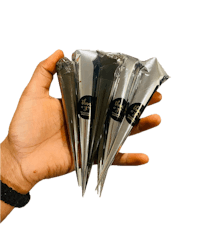 a person holding a pack of silver cones