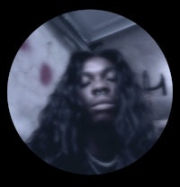 a black man with long hair in a circle